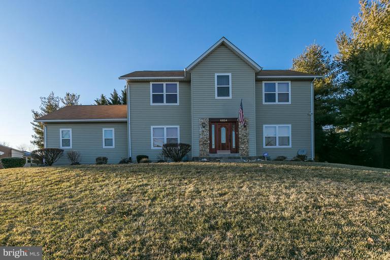 6824 Old Pimlico Road Baltimore, MD 21209 - Photo 1 of 20 a view of a house with a yard