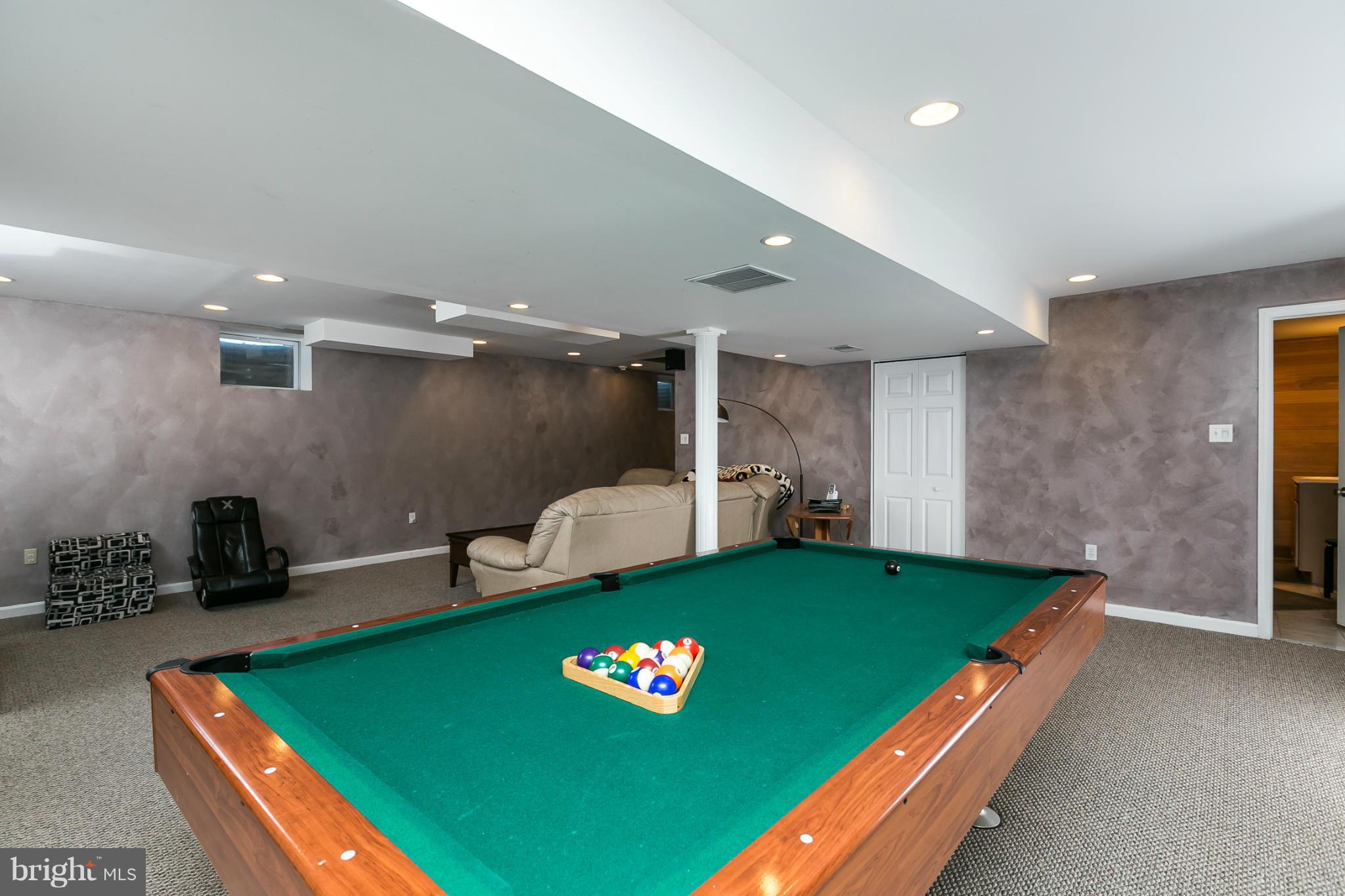 6824 Old Pimlico Road Baltimore, MD 21209 - Photo 17 of 20 a room with pool table and a couch