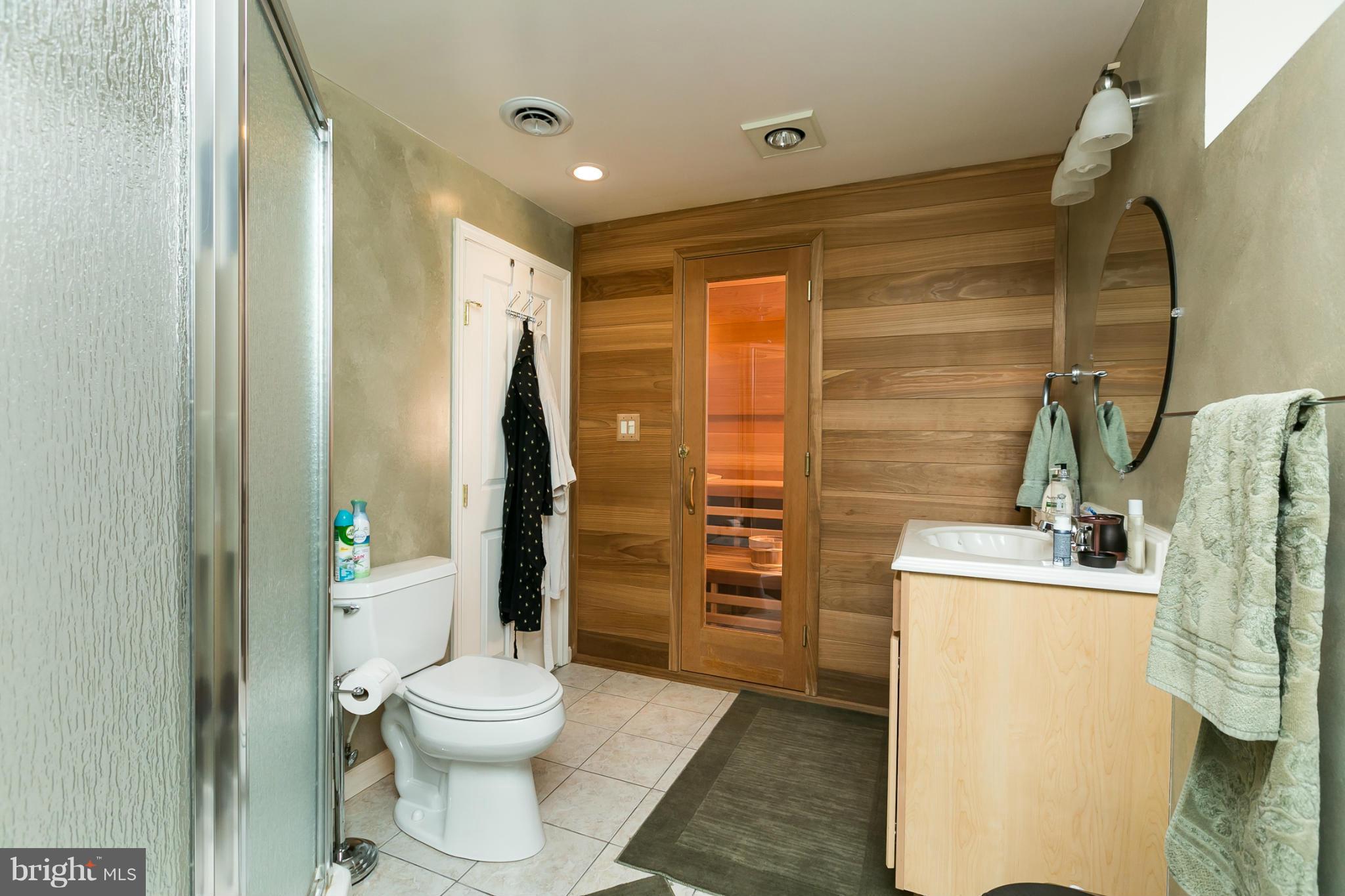 6824 Old Pimlico Road Baltimore, MD 21209 - Photo 18 of 20 a bathroom with a sink toilet and shower