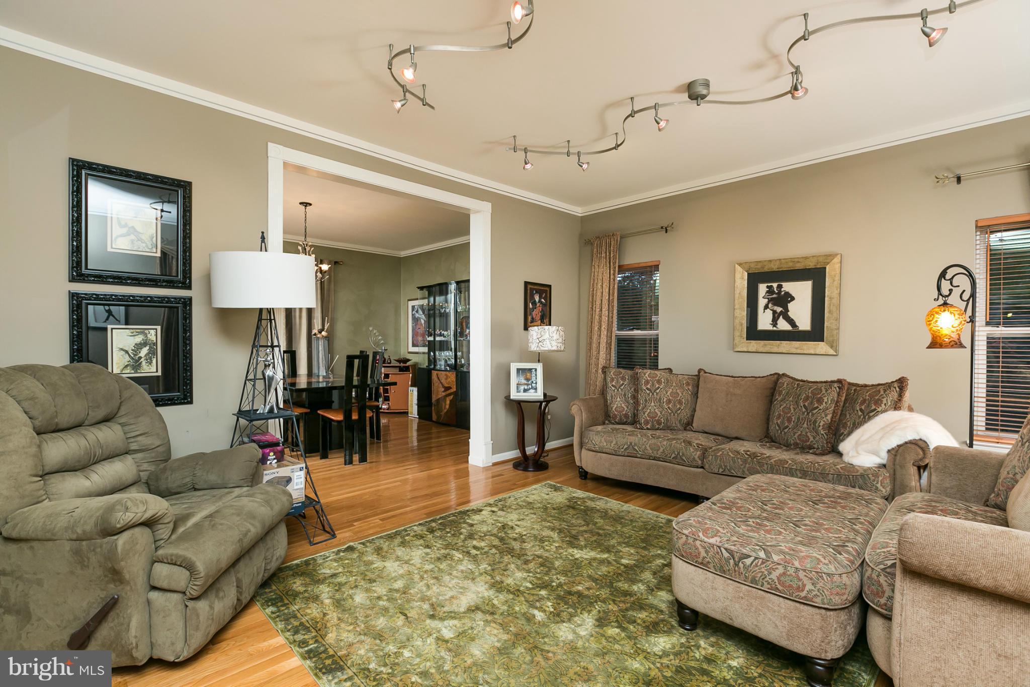6824 Old Pimlico Road Baltimore, MD 21209 - Photo 5 of 20 a living room with furniture and a lamp