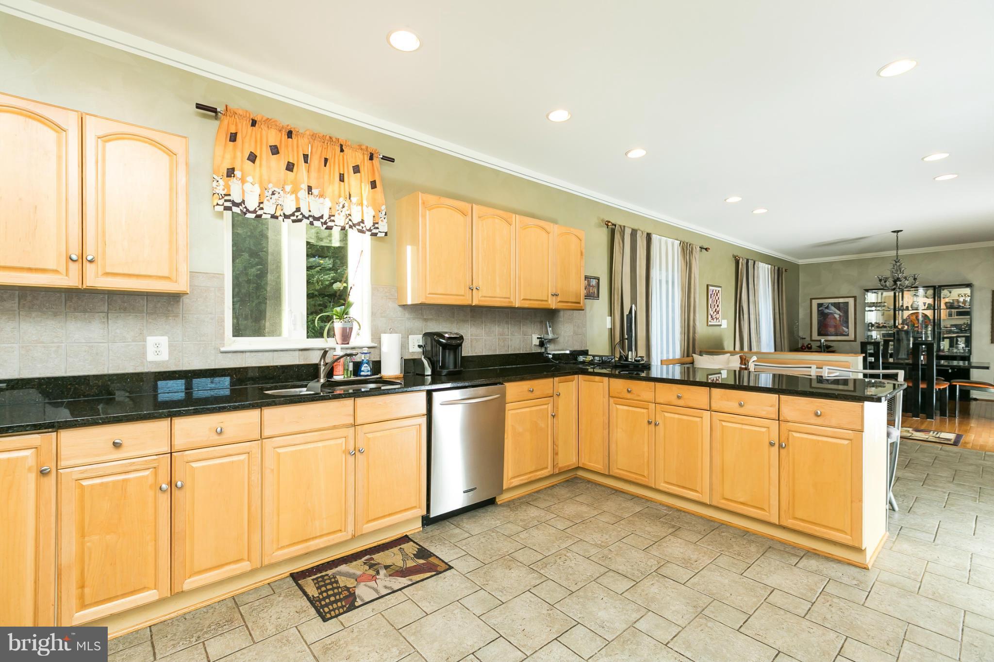 6824 Old Pimlico Road Baltimore, MD 21209 - Photo 9 of 20 a large kitchen with granite countertop a large window in it