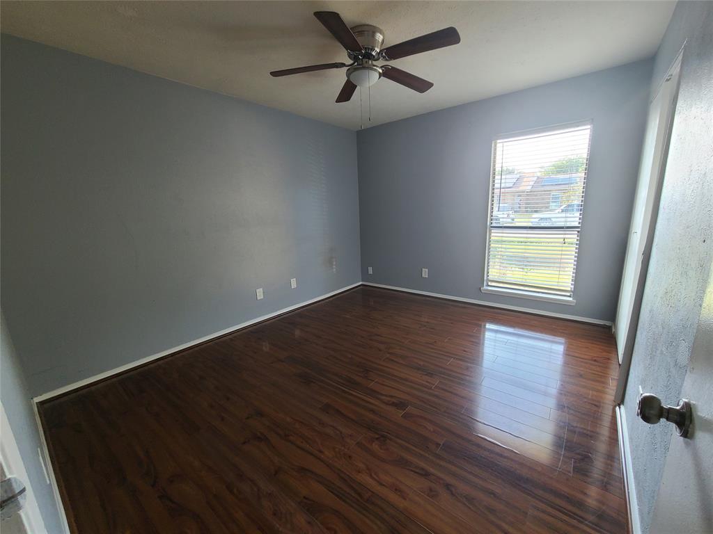 5644 Perrin Street The Colony, TX 75056 - Photo 8 of 16 Spare room with ceiling fan and hardwood / wood-style floors