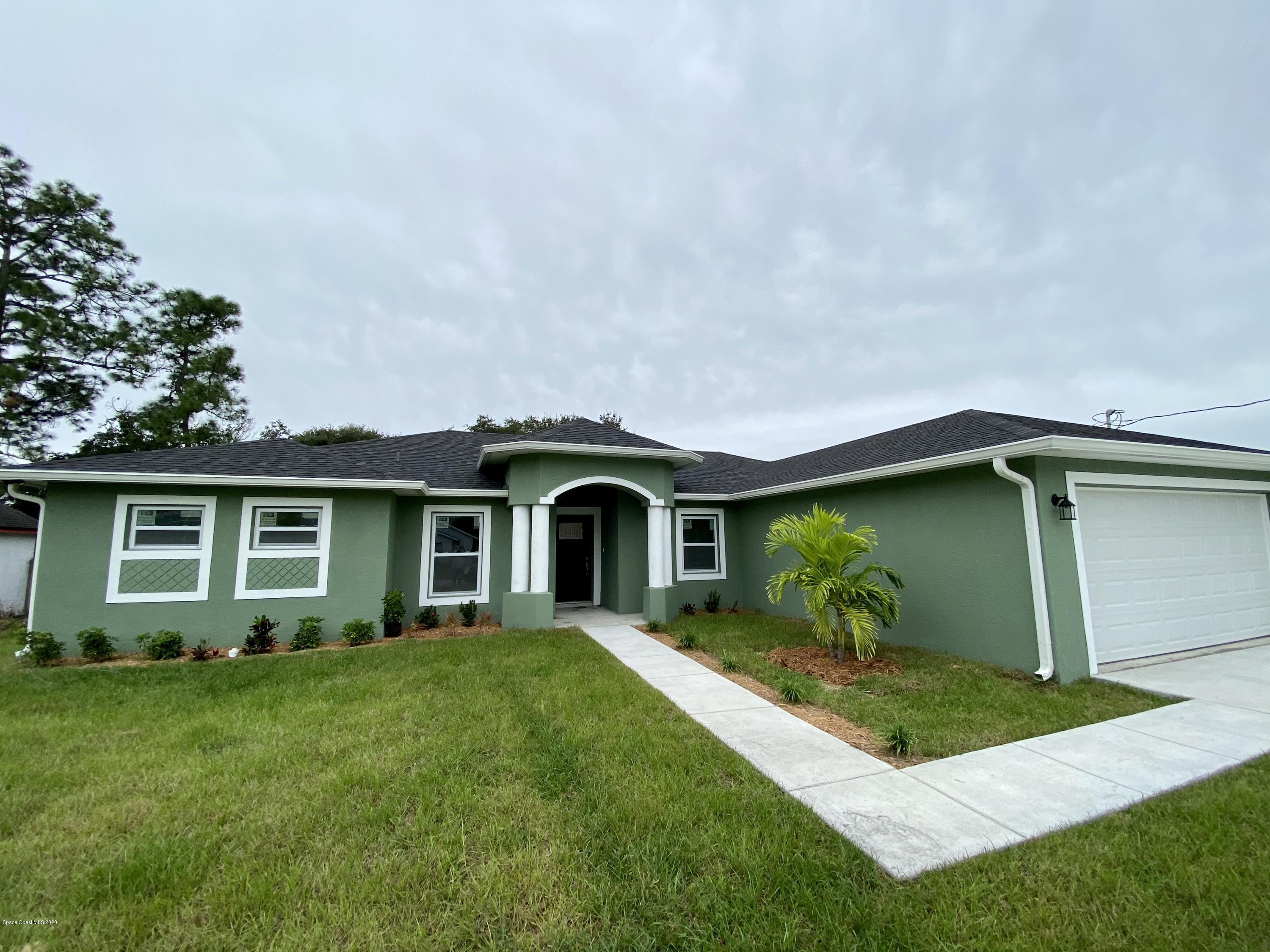 6444 Hudson Road Cocoa, FL 32927 - Photo 2 of 21 a front view of house with yard and green space