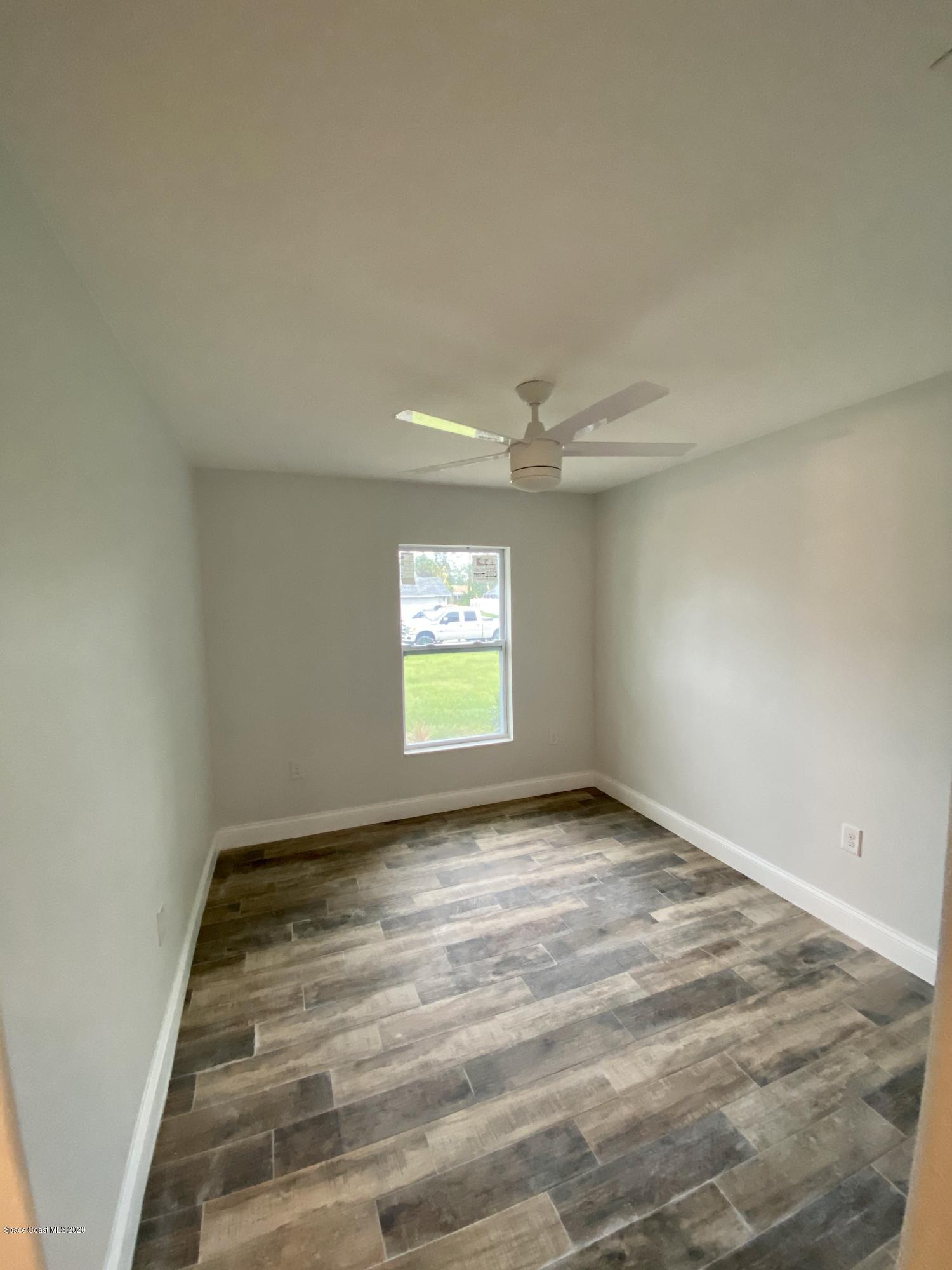 6444 Hudson Road Cocoa, FL 32927 - Photo 11 of 21 an empty room with a empty space and windows