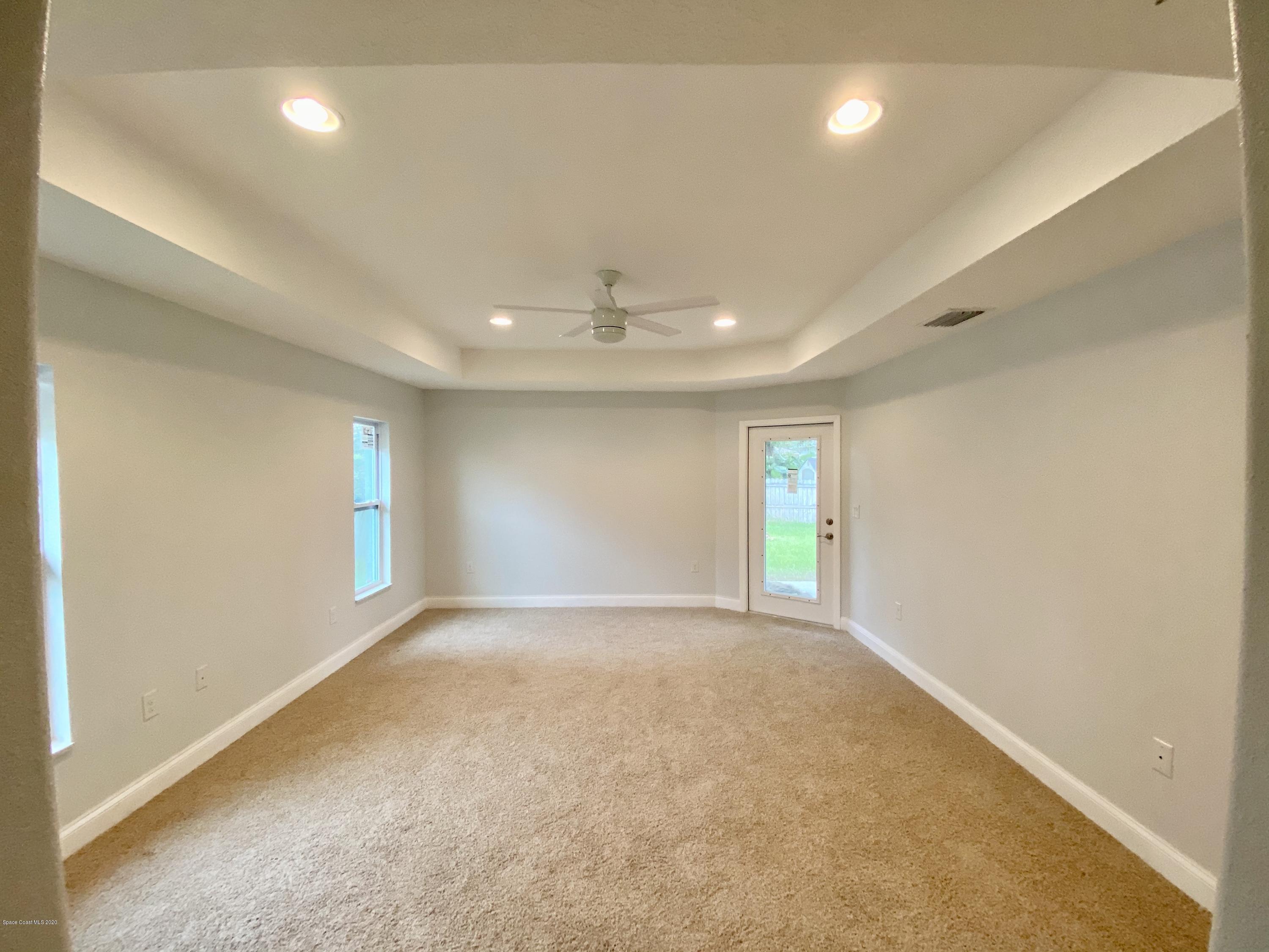 6444 Hudson Road Cocoa, FL 32927 - Photo 12 of 21 an empty room with windows and closet