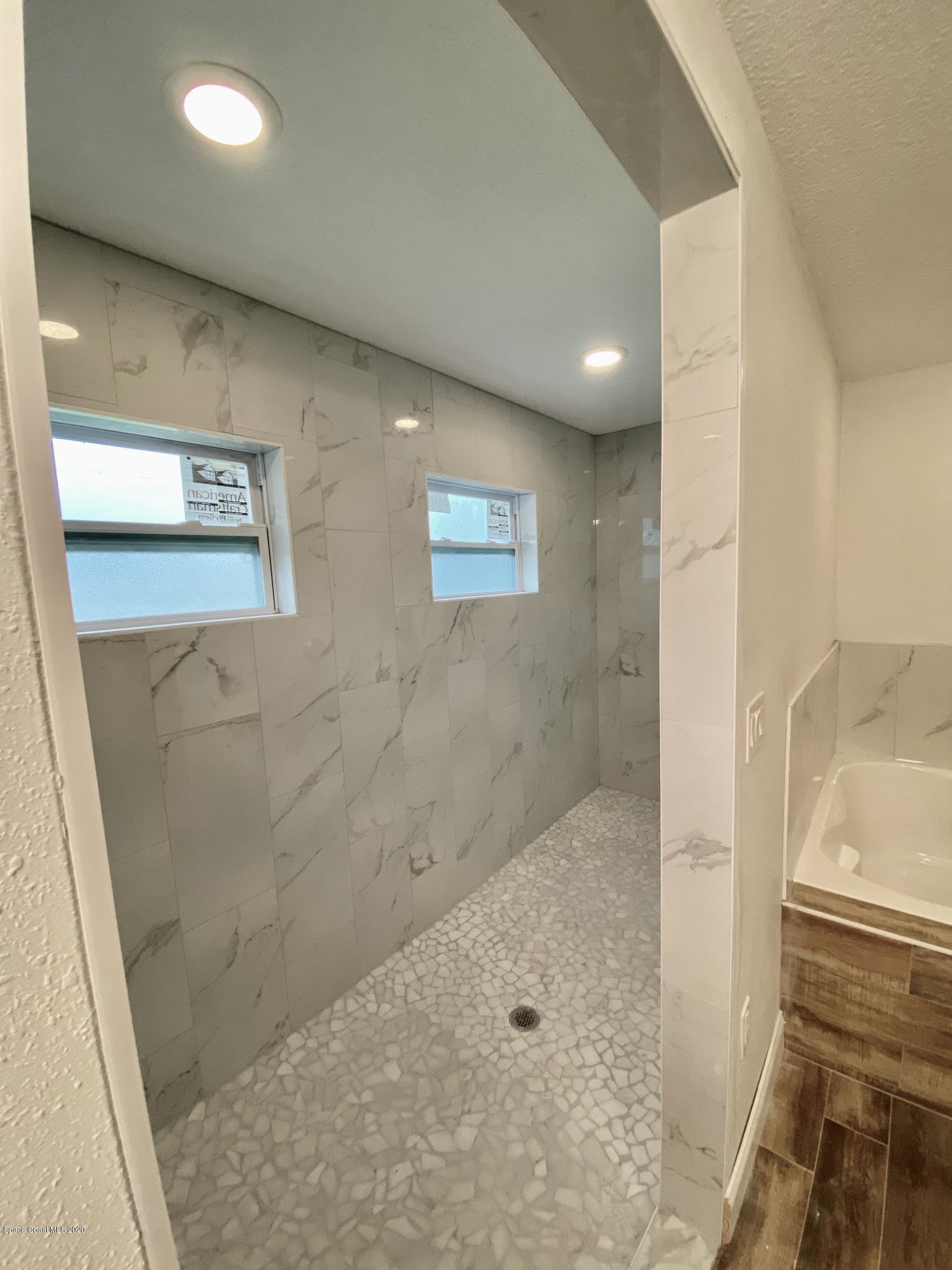 6444 Hudson Road Cocoa, FL 32927 - Photo 15 of 21 a bathroom with a shower