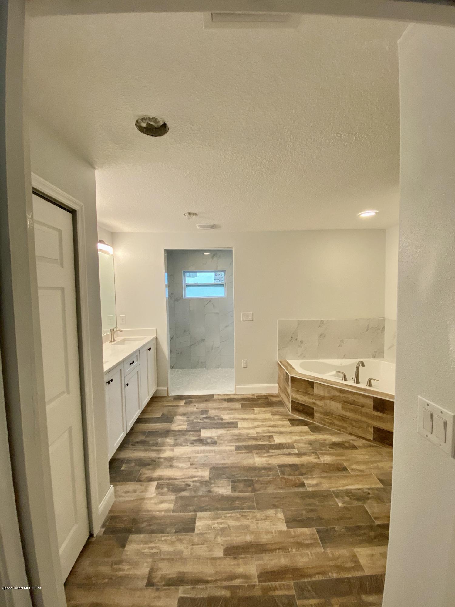 6444 Hudson Road Cocoa, FL 32927 - Photo 17 of 21 a view of a kitchen with a sink and wooden floor