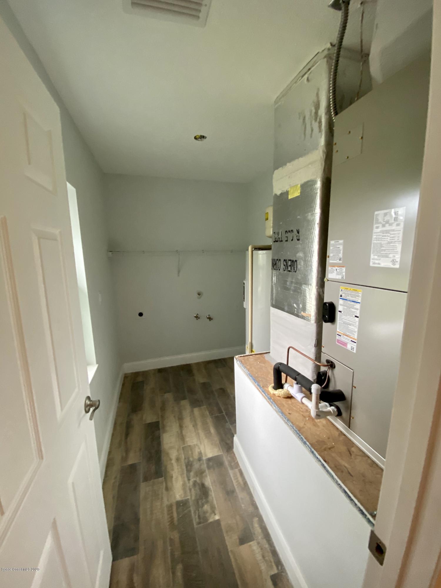 6444 Hudson Road Cocoa, FL 32927 - Photo 20 of 21 a room with a sink and a mirror
