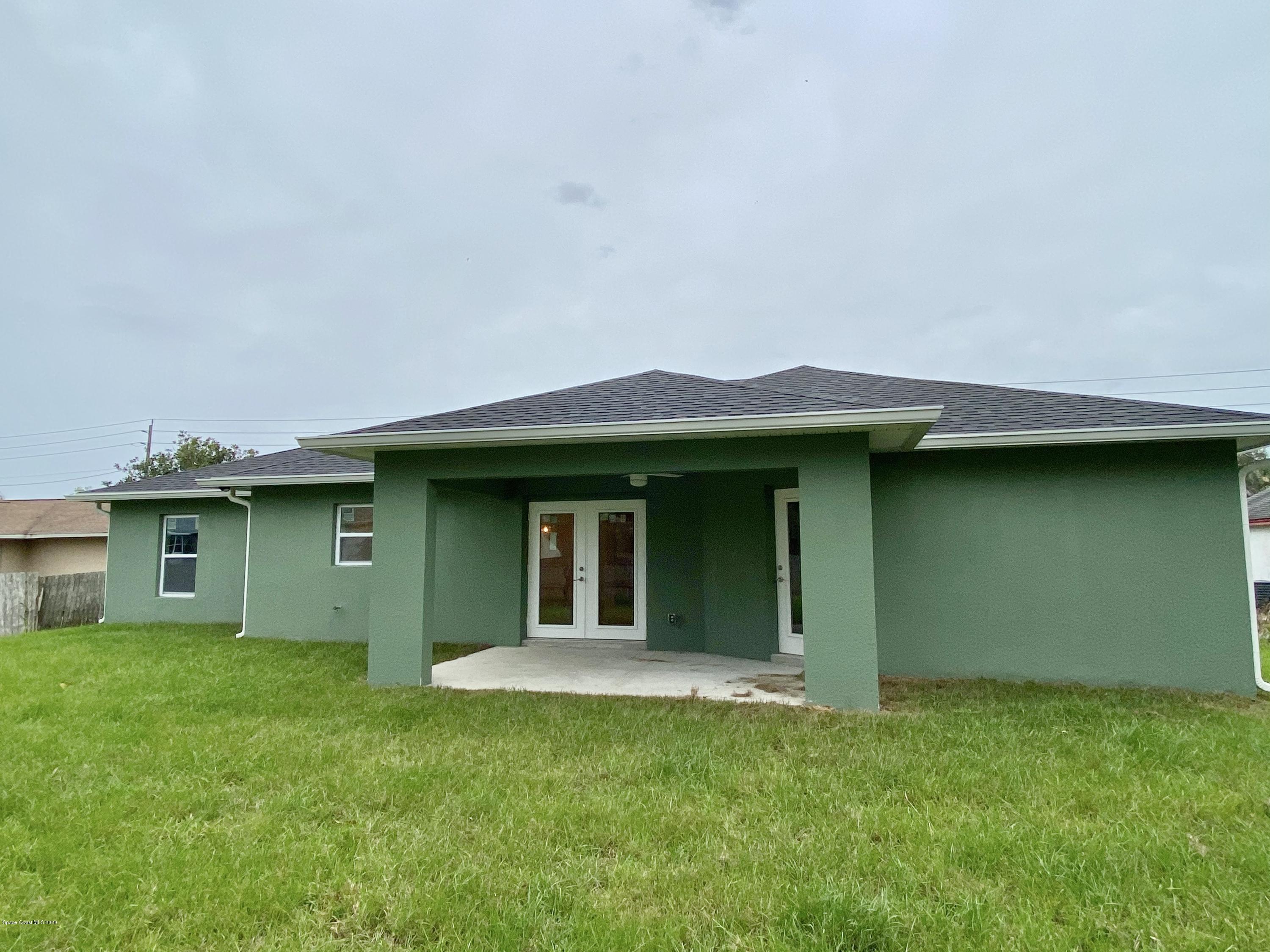 6444 Hudson Road Cocoa, FL 32927 - Photo 21 of 21 a view of a house with a backyard