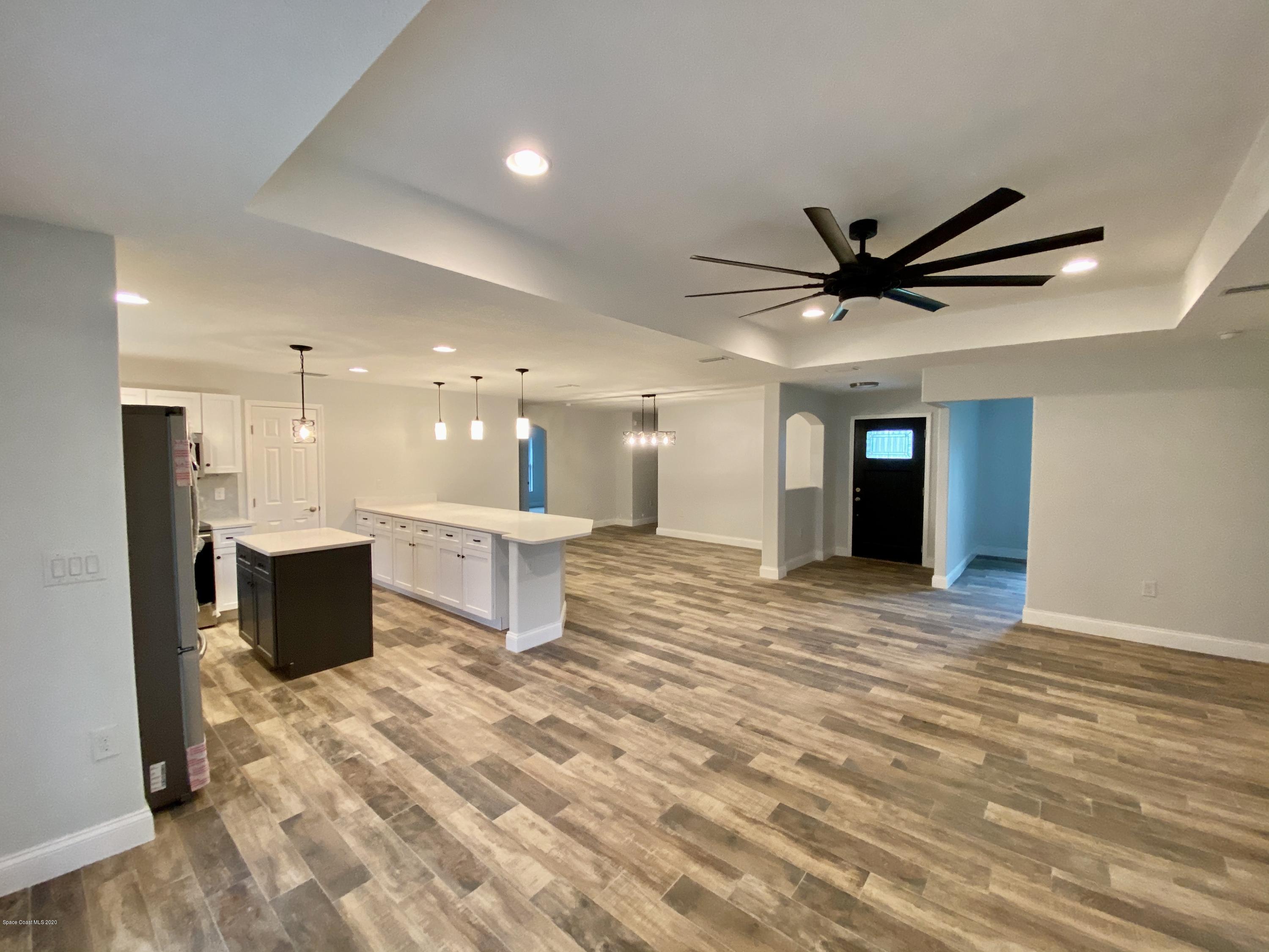 6444 Hudson Road Cocoa, FL 32927 - Photo 4 of 21 a view of a big room with kitchen view and a window