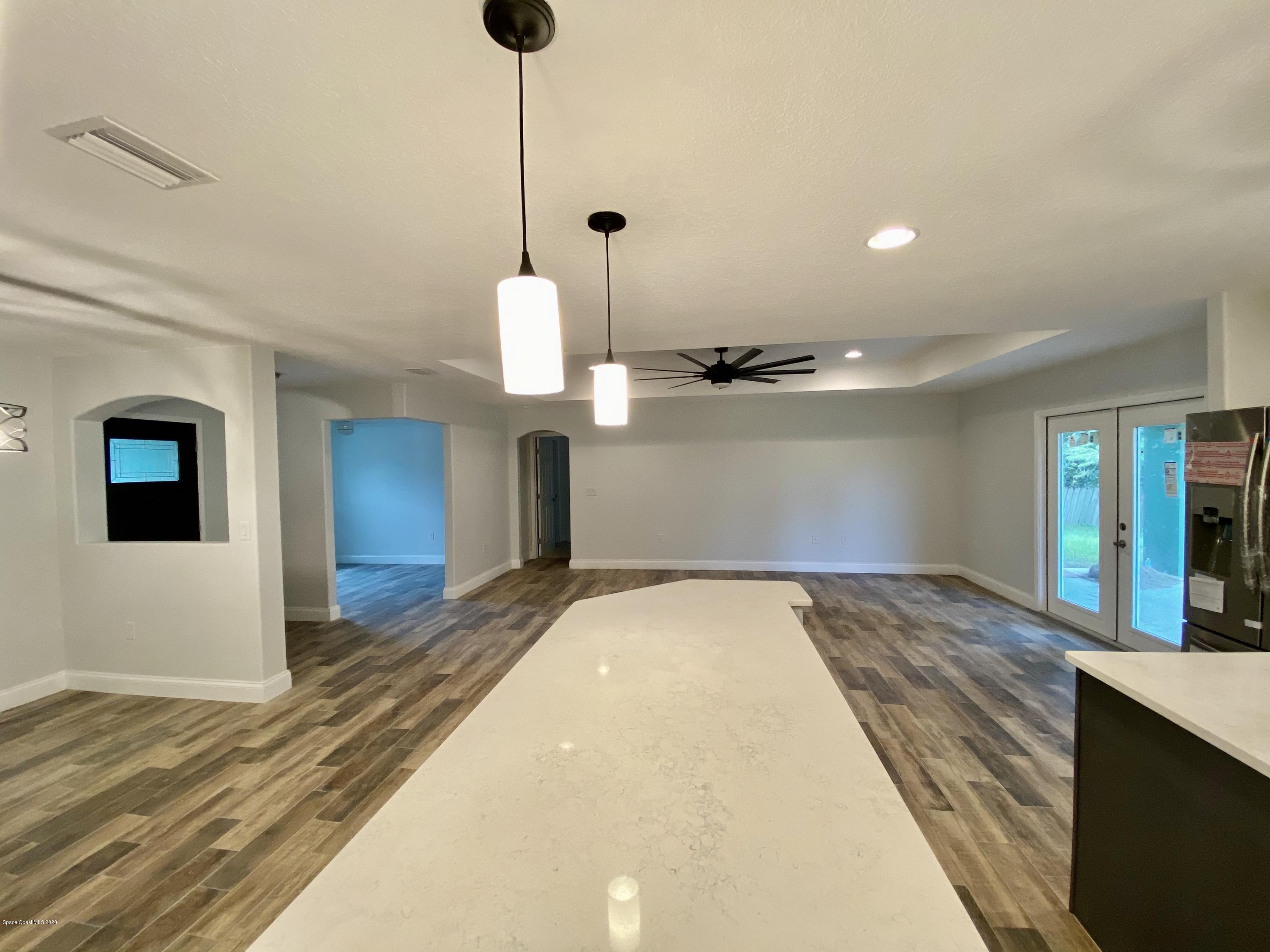 6444 Hudson Road Cocoa, FL 32927 - Photo 8 of 21 a view of a kitchen with a sink and wooden floor