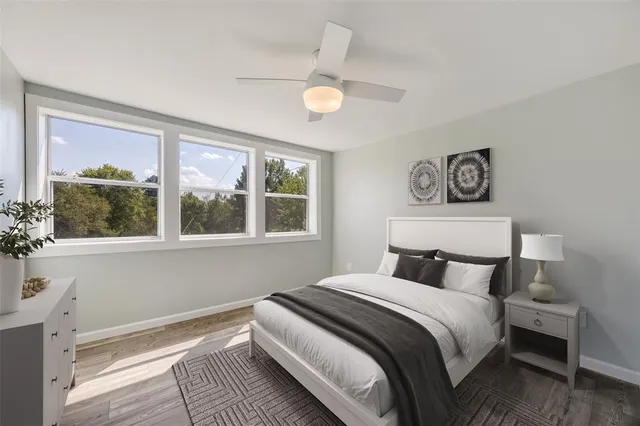 a bedroom with a large bed and a window