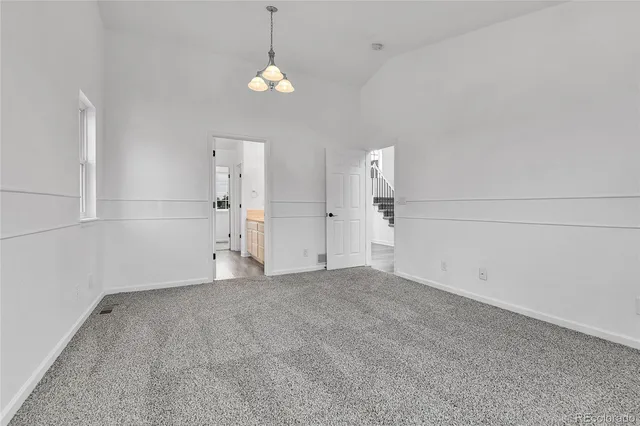 an empty room with a empty space and windows