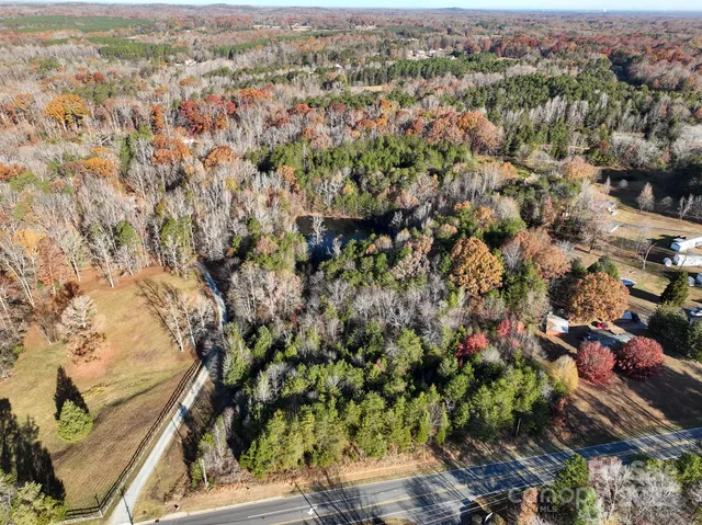 an aerial view of residential house with green space