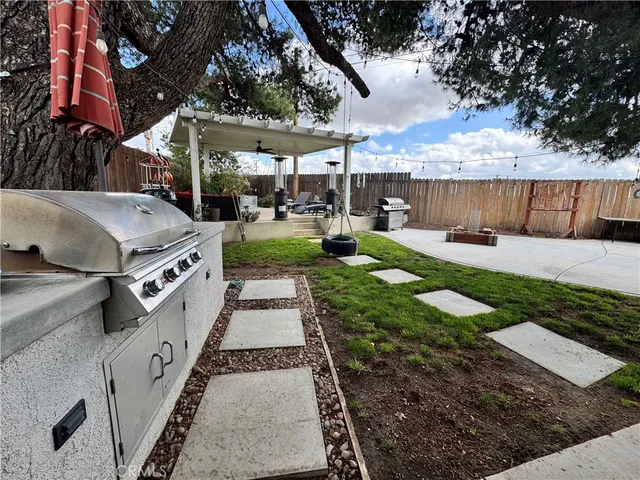 a view of a backyard with sitting area