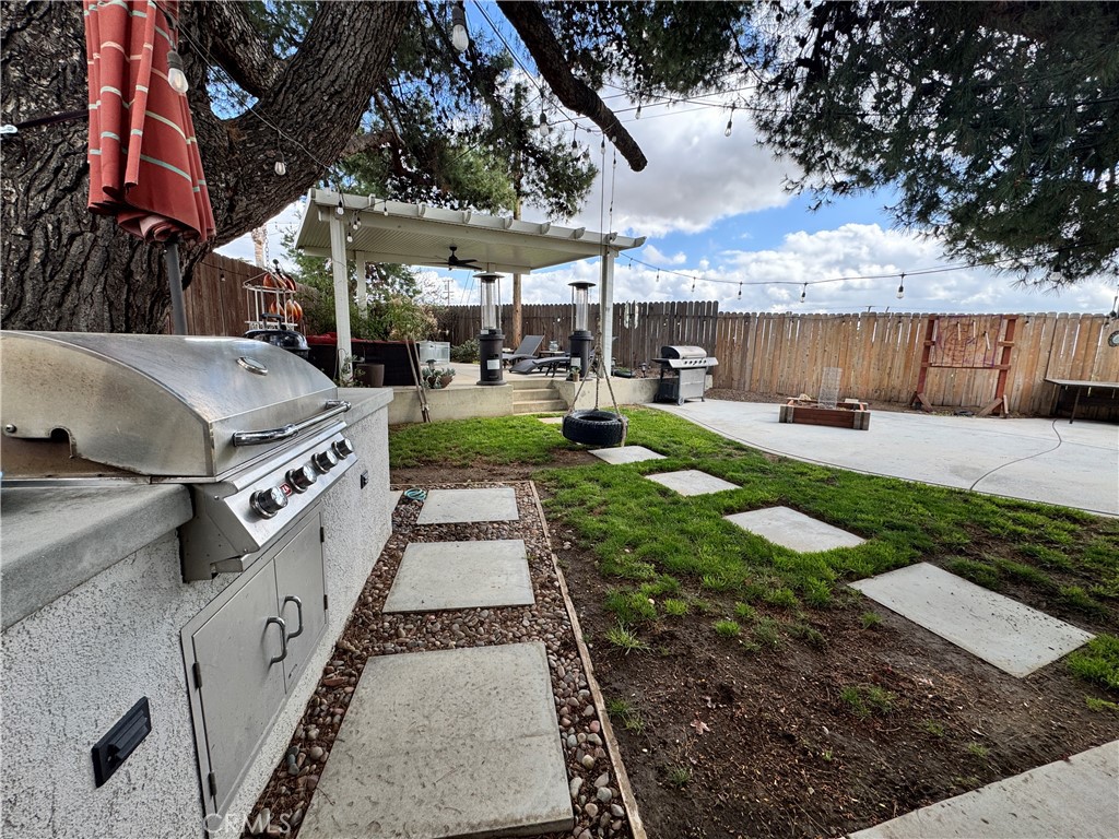 40451 Rome Beauty Way Cherry Valley, CA 92223 - Photo 12 of 25 a view of a backyard with sitting area