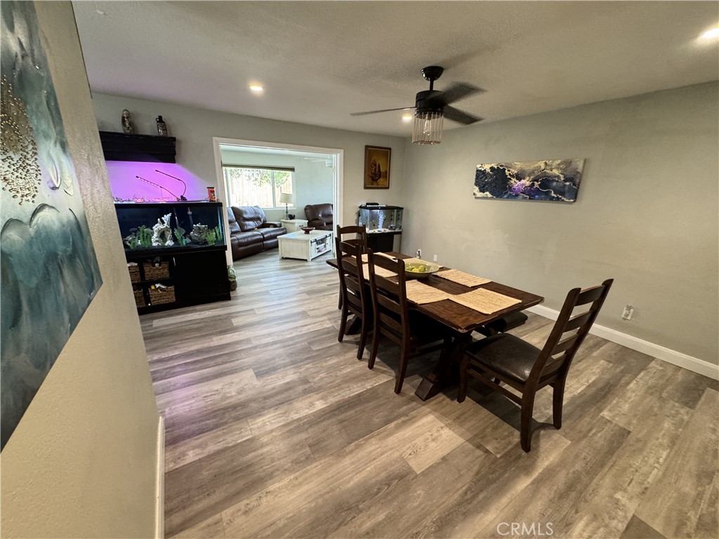 40451 Rome Beauty Way Cherry Valley, CA 92223 - Photo 18 of 25 a living room with furniture a flat screen tv and a table