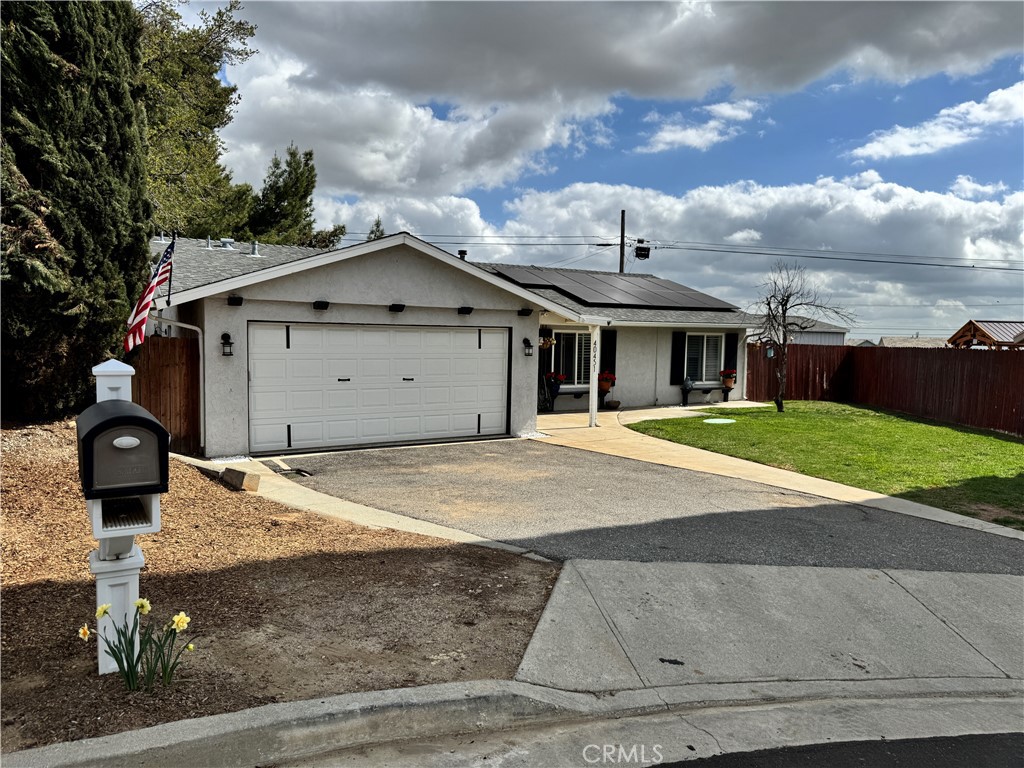 40451 Rome Beauty Way Cherry Valley, CA 92223 - Photo 25 of 25 a front view of a house with a garden