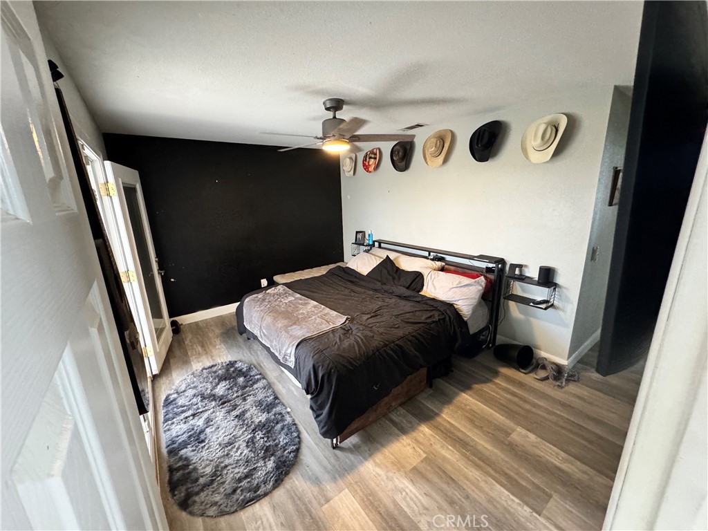 40451 Rome Beauty Way Cherry Valley, CA 92223 - Photo 9 of 25 a bedroom with a bed and a rug