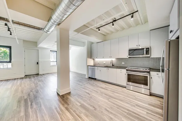 a view of a room with wooden floor and iron walls