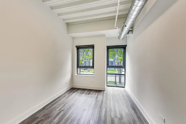a view of a livingroom with furniture and staircase