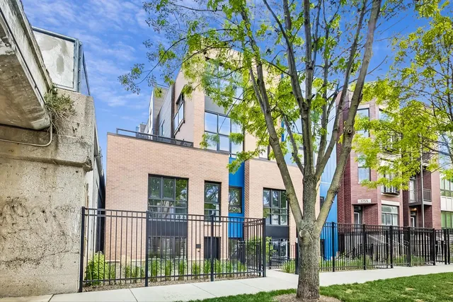a view of a brick house with a large windows