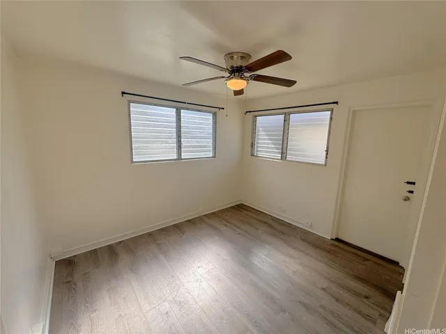 a view of a livingroom with wooden floor