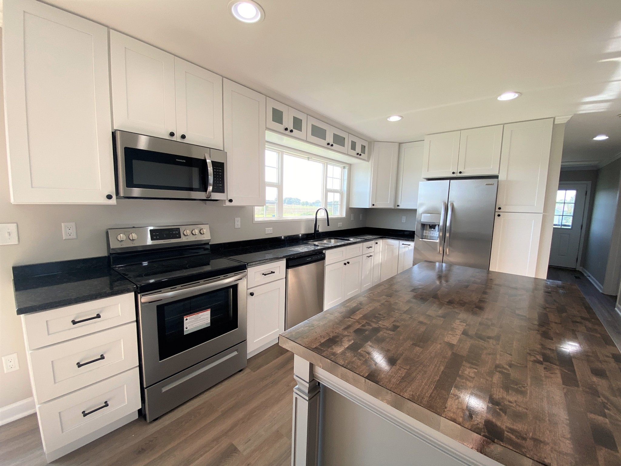 525 Cook Road Portland, TN 37148 - Photo 3 of 32 a kitchen with stainless steel appliances granite countertop a stove a sink and a microwave