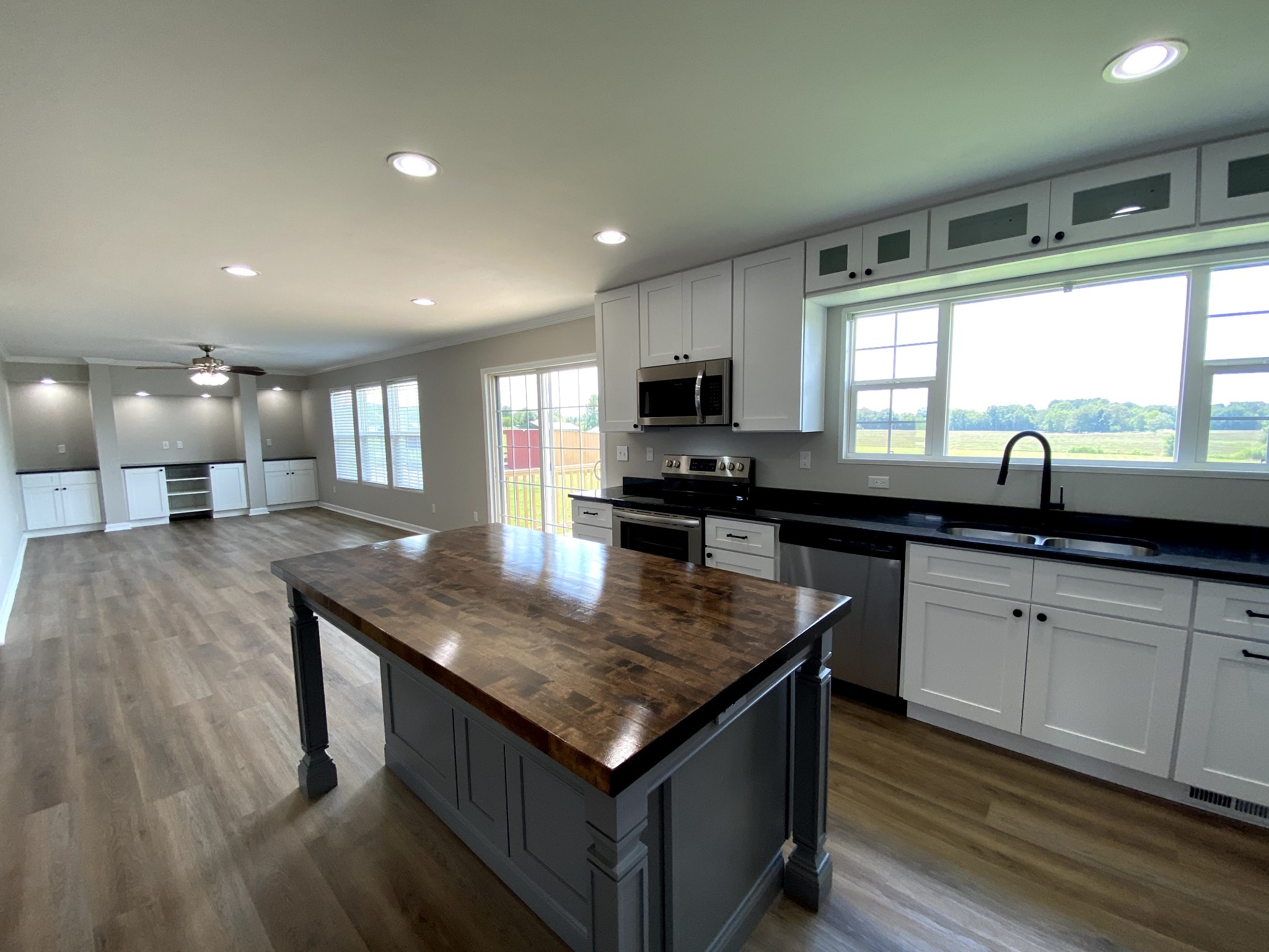 525 Cook Road Portland, TN 37148 - Photo 5 of 32 a kitchen with stainless steel appliances granite countertop a sink a stove and a wooden cabinets