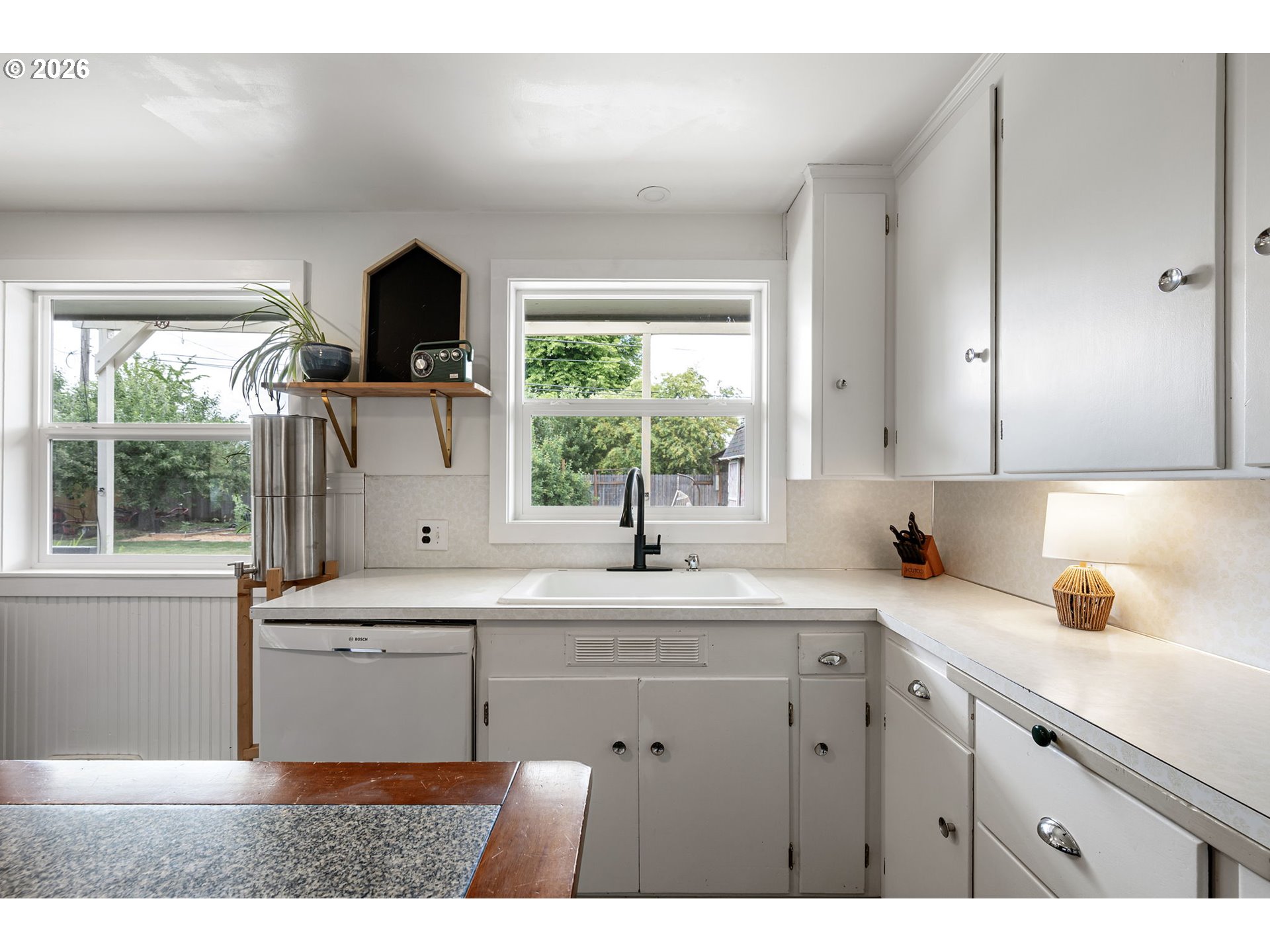 765 Louis Street Eugene, OR 97402 - Photo 13 of 45 a kitchen with a sink cabinets and window