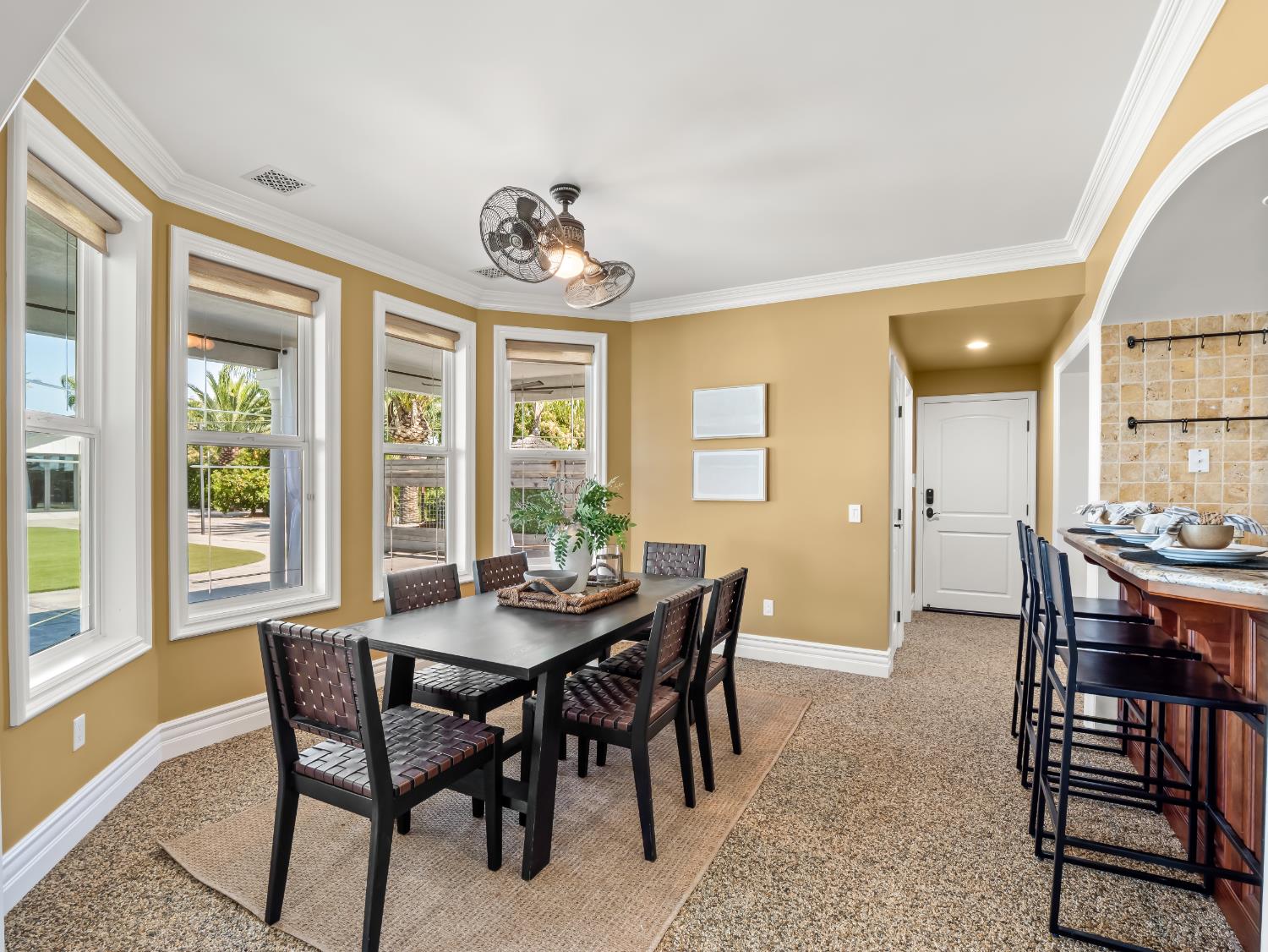 17113 Mark Road Madera, CA 93636 - Photo 21 of 99 a view of a dining room with furniture and windows
