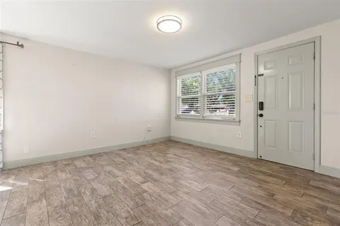 a view of an empty room with a window