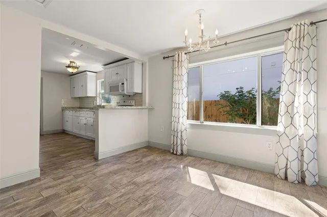 a kitchen with stainless steel appliances granite countertop a stove and a refrigerator