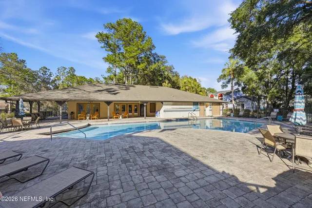 a view of a chairs and table in the patio