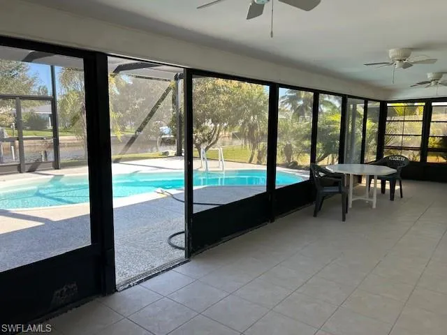 a lobby with furniture and large windows