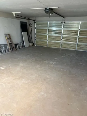 a view of room with stairs and a chair