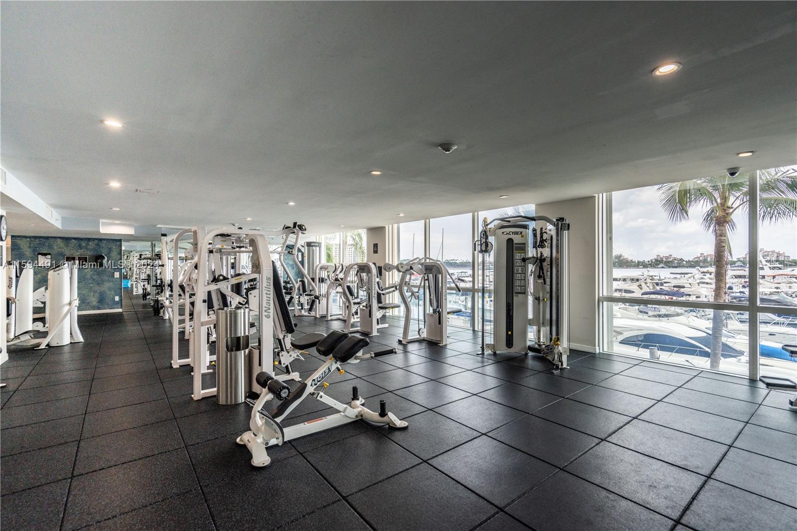 90 Alton Road, Unit 2807 Miami Beach, FL 33139 - Photo 18 of 27 a view of a room with gym equipment