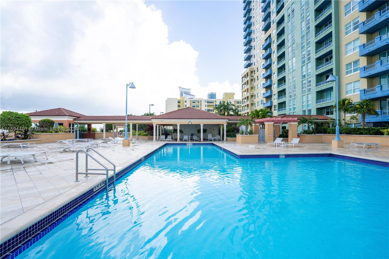 90 Alton Road, Unit 2807 Miami Beach, FL 33139 - Photo 21 of 27 a view of a swimming pool with a deck