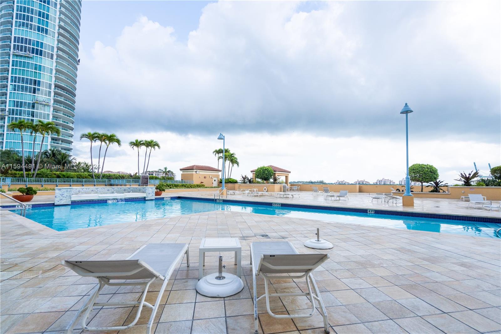 90 Alton Road, Unit 2807 Miami Beach, FL 33139 - Photo 22 of 27 a view of swimming pool with outdoor seating