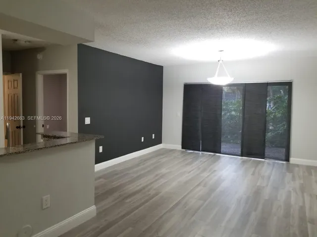 a view of a kitchen with a sink