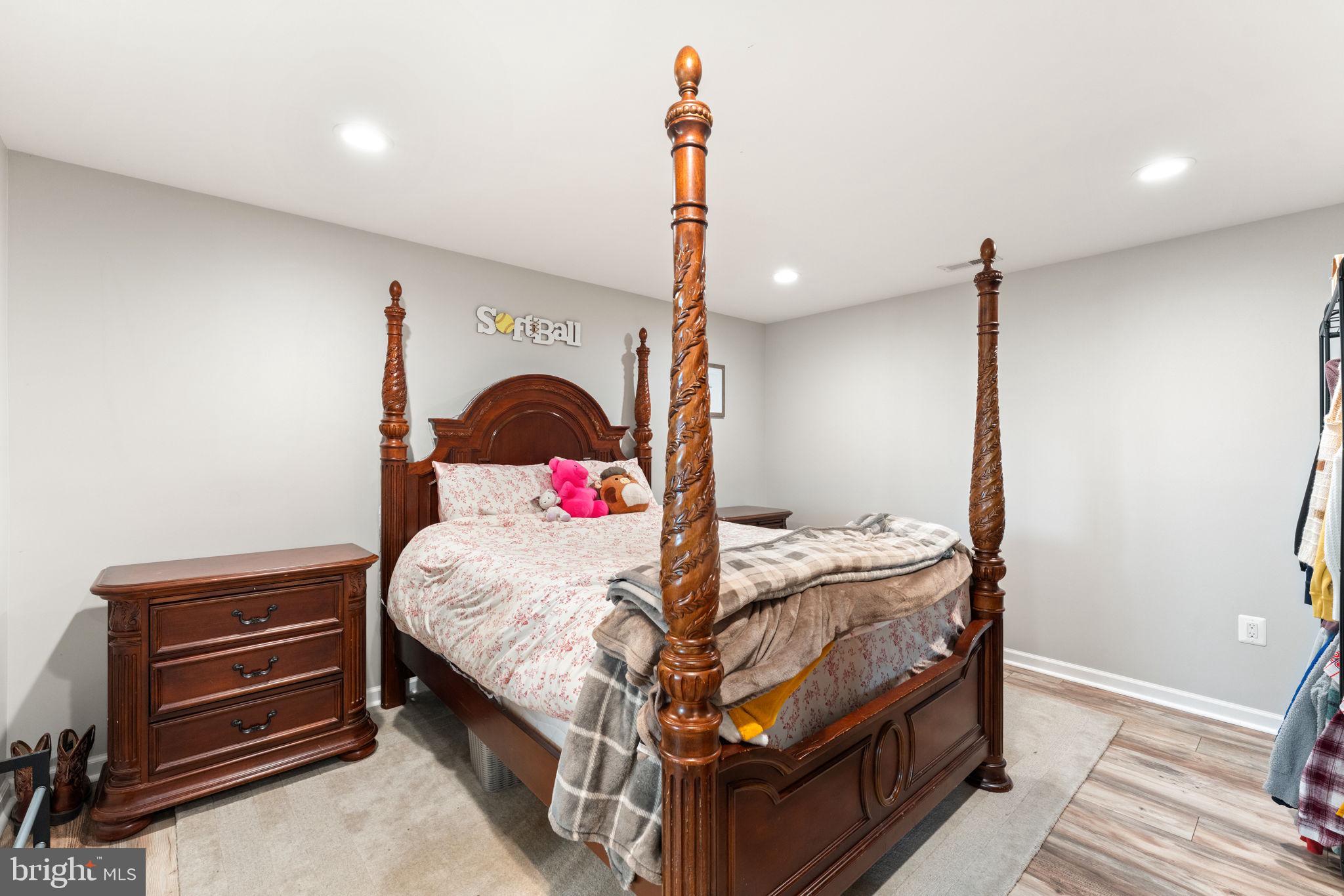 1388 Novum Church Road Reva, VA 22735 - Photo 44 of 65 a bedroom with a bed and a dresser with wooden floor