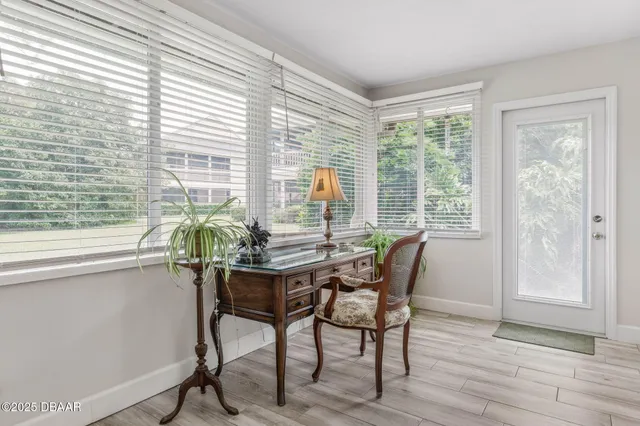 a kitchen with a sink stainless steel appliances a counter top space and cabinets