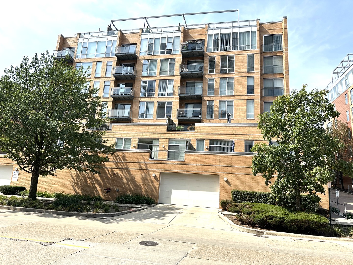 1720 Oak Avenue, Unit 706 Evanston, IL 60201 - Photo 1 of 27 a front view of a building with a garden