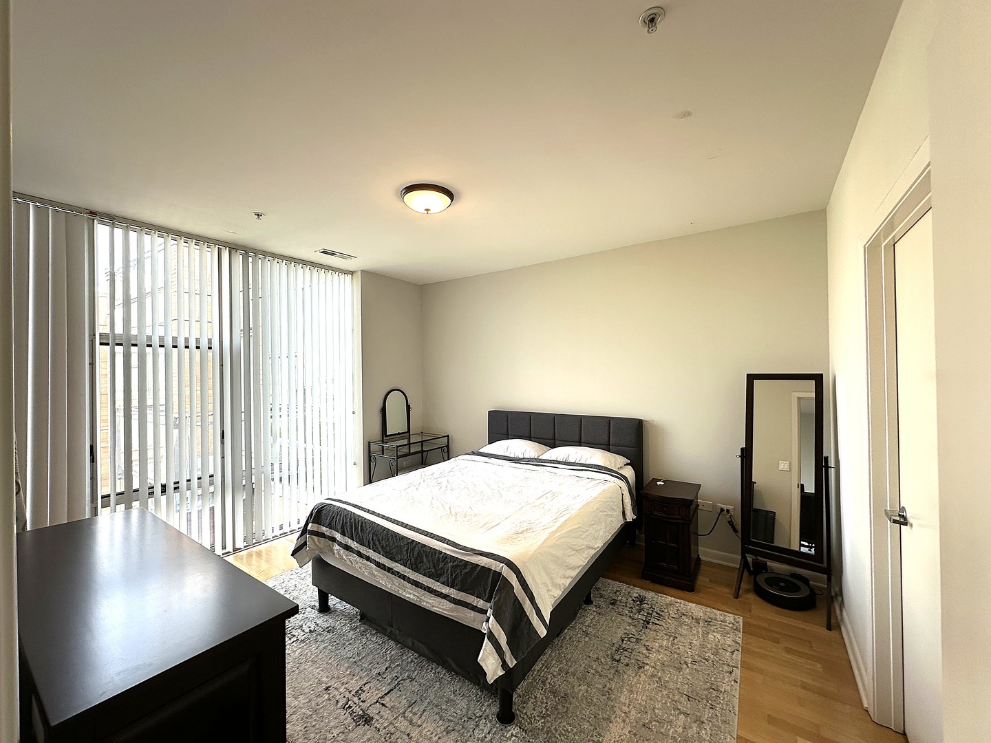 1720 Oak Avenue, Unit 706 Evanston, IL 60201 - Photo 15 of 27 a bedroom with a bed and a window with outer view