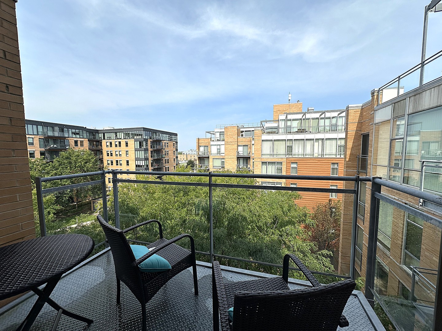 1720 Oak Avenue, Unit 706 Evanston, IL 60201 - Photo 22 of 27 a view of a chairs and table in a balcony