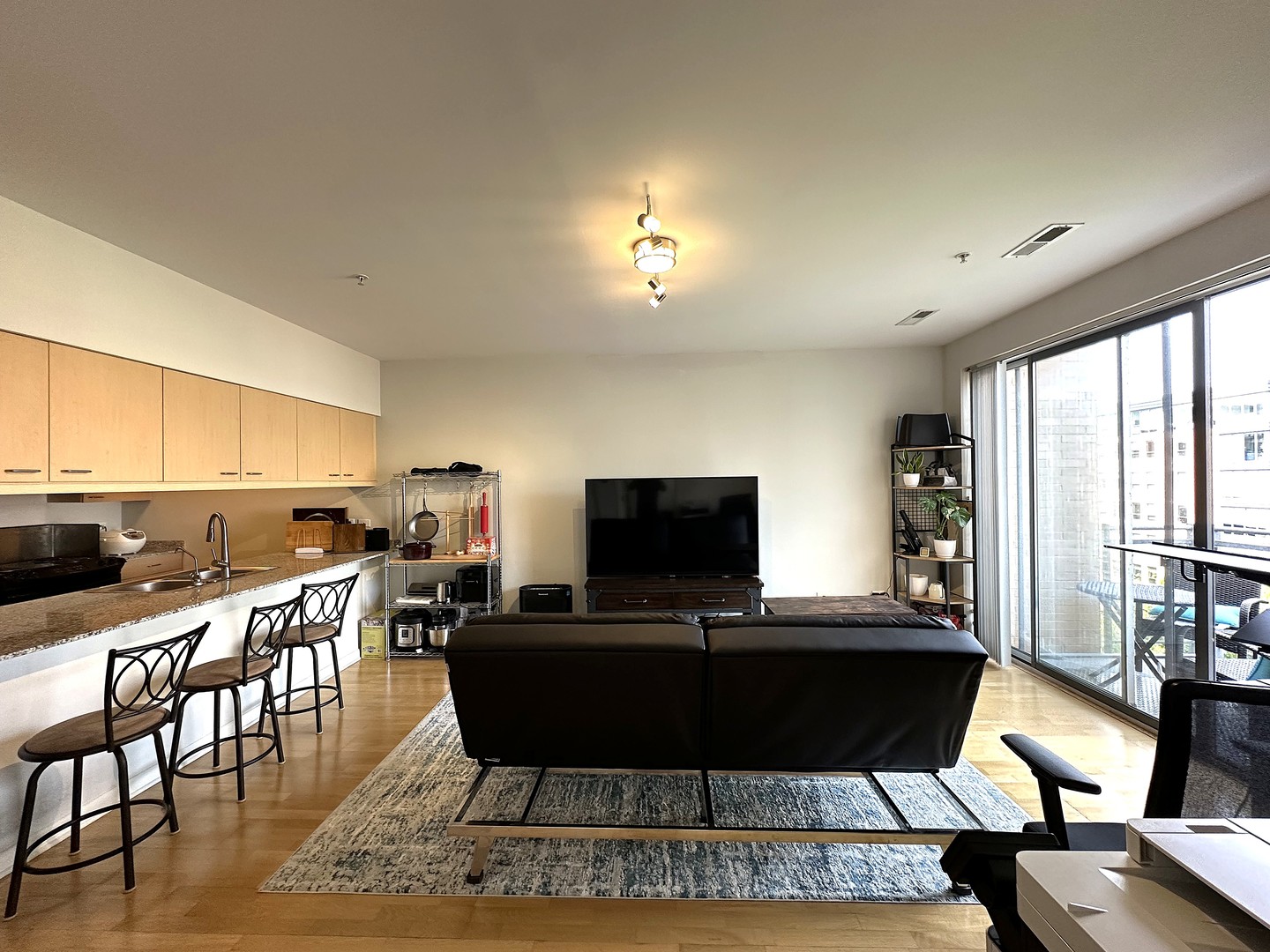 1720 Oak Avenue, Unit 706 Evanston, IL 60201 - Photo 3 of 27 a living room with furniture a piano and a flat screen tv