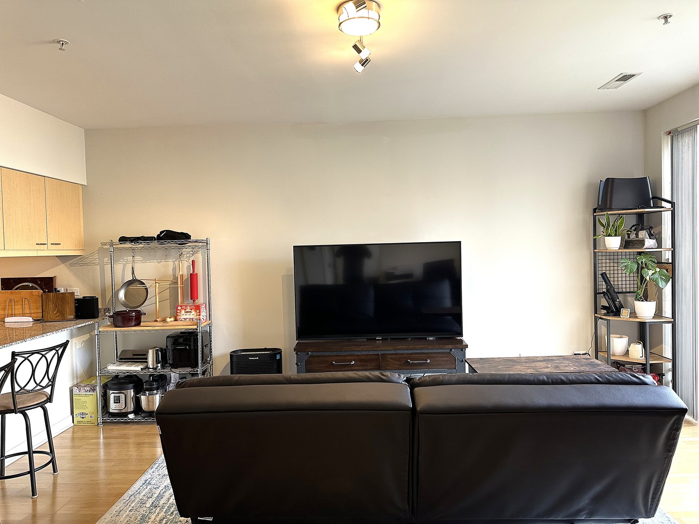 1720 Oak Avenue, Unit 706 Evanston, IL 60201 - Photo 5 of 27 a living room with furniture and a flat screen tv