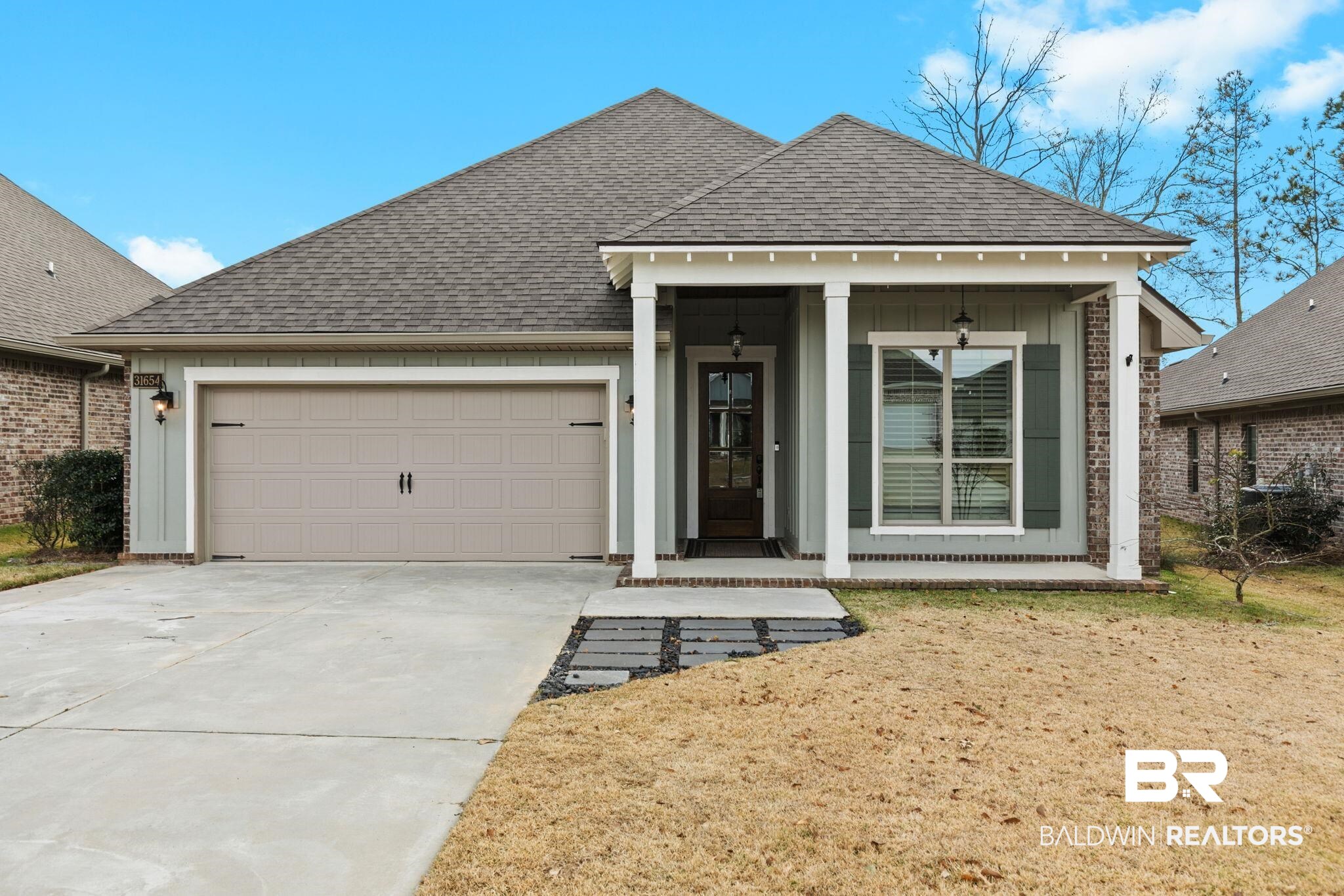 31654 Canopy Loop Daphne, AL 36527 - Photo 1 of 64 View of front of home featuring a shingled roof, concrete driveway, and an attached garage
