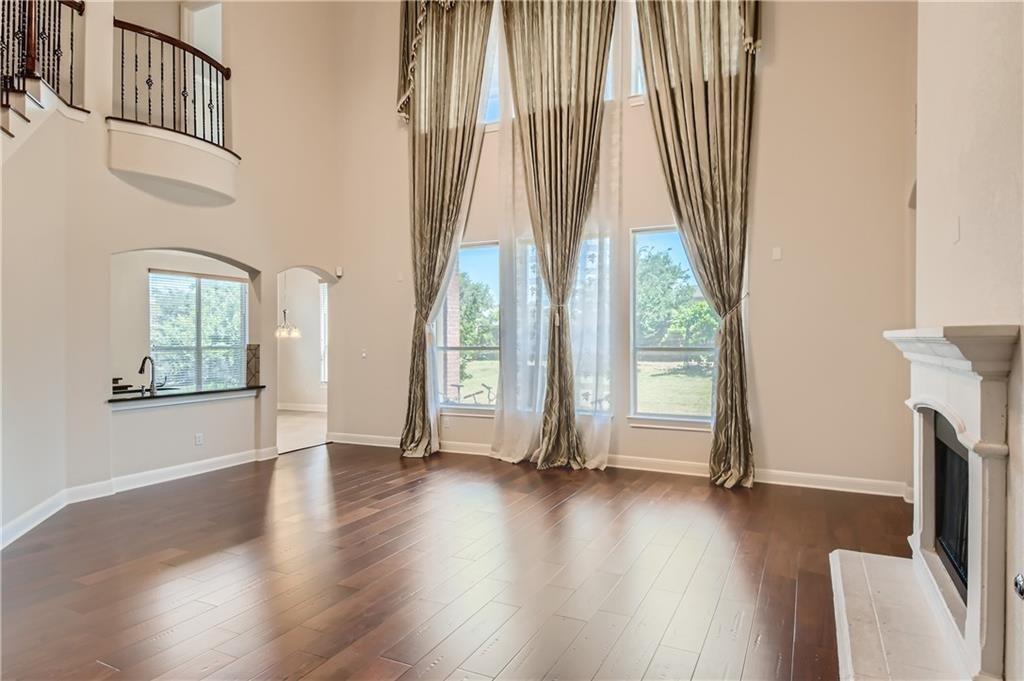 3822 Remington Road Cedar Park, TX 78613 - Photo 13 of 31 an empty room with wooden floor and windows