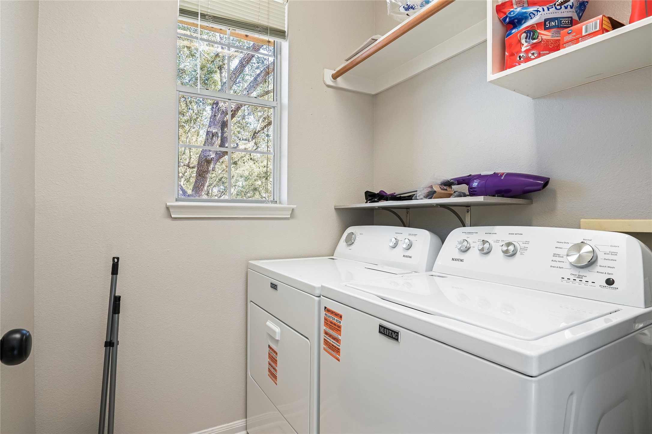 5710 Shady Hollow Court Rosharon, TX 77583 - Photo 13 of 25 a utility room with dryer and washer